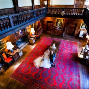 The newlyweds captured from the balcony in the majestic Great Hall