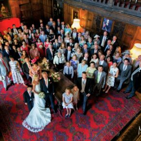 Large group pose from above in the Great Hall of this Grade II listed property