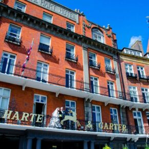Harte and Garter wedding photography - the couple on the terrace captured from street level