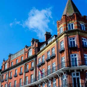 Harte and Garter wedding photography - grand Victorian exterior under perfect blue skies