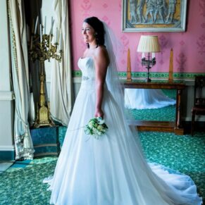 Hartwell House wedding photography - the bride glances out into the gardens