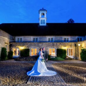 The Hartwell House newlyweds captured at dusk under perfect dusky blue skies in the Hartwell Court area of this grand hotel