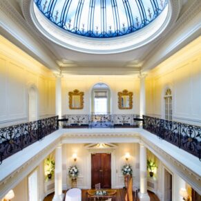 The Centre Hall with its doomed ceiling and mezzanine balcony inside this historic Chilterns wedding venue