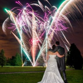A grand fireworks finale including the bride and groom in the foreground for their Hedsor House wedding day celebrations