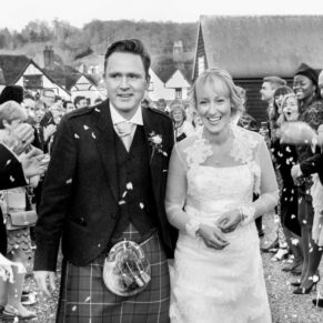 Kings Chapel Amersham wedding photography of the newlyweds making their way through the confetti aisle