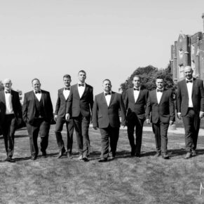 The lads walking towards my camera with the venue behind