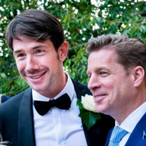 Two lads enjoying the party atmosphere during the drinks reception at Le Manoir Aux Quat Saisons
