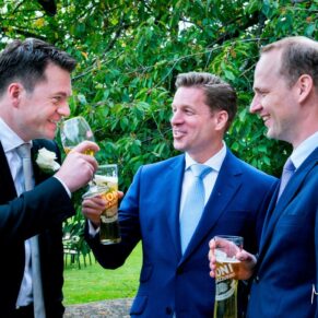 Reportage wedding photography of some of the guys during the drinks reception at Le Manoir Aux Quat Saisons