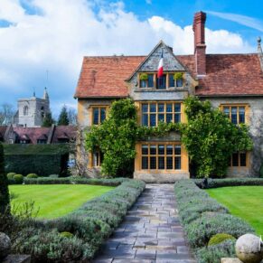 The stunning exterior of Le Manoir Aux Quat Saisons on a glorious summer's day