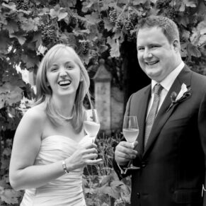 Le Manoir Aux Quat Saisons wedding photography of the newlyweds enjoying a glass of champagne
