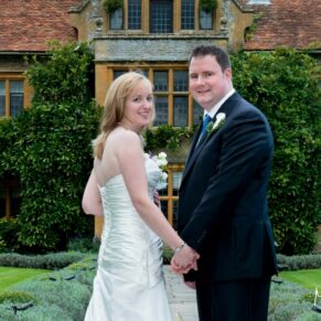 The newlyweds look back at the camera during the photo session at their Le Manoir Aux Quat Saisons wedding