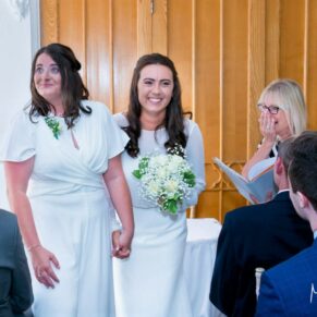 Same sex Buckinghamshire wedding photography of the newlyweds during the civil ceremony at Missenden Abbey