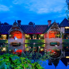The pavilions across the lake at dusk for this summer's day wedding