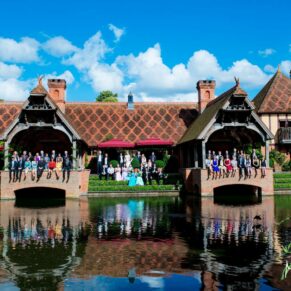 All the guests captured across the lake under near perfect blue skies during this lovely wedding reception at The Dairy