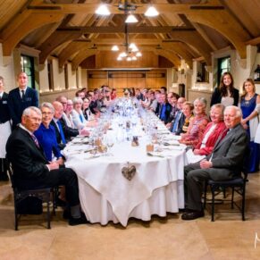 All of the guests with the staff in the West Hall around the banqueting table at The Dairy
