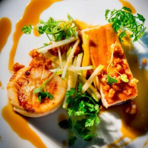 Scrumptious main course captured with atmospheric lighting during this wedding breakfast at The Dairy