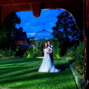 The newlyweds photographed at dusk with my floodlighting illuminating this view of the area around the Buttery at The Dairy