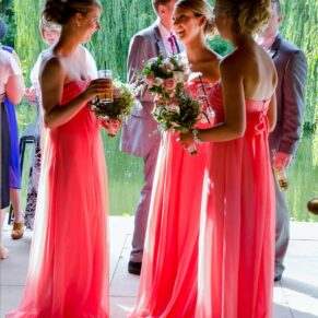 Dramatic back lighting for this candid shot of these three colourful bridesmaids captured at The Dairy