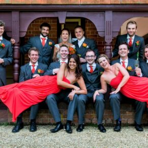 A fun relaxed pose of the bridal party outside the Buttery at The Dairy on a summer's day