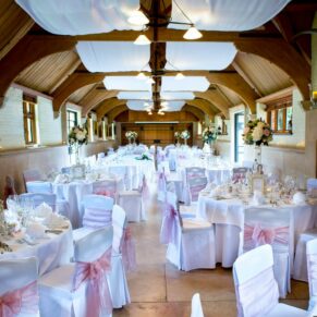 The impressive high ceilinged West Hall all setup for the wedding breakfast at The Dairy on the Waddesdon Estate