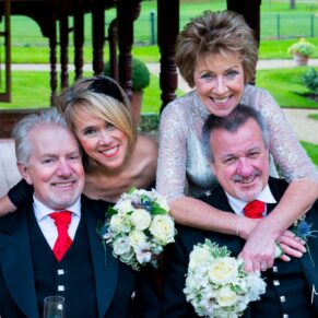 The newlyweds with their best man and bridesmaid for this very relaxed pose next to the Buttery
