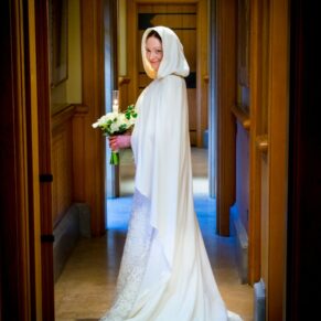 The bride all cloaked up for her winter wedding at The Dairy