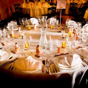 Dramatic lighting falls across this table setup for the wedding breakfast at The Dairy