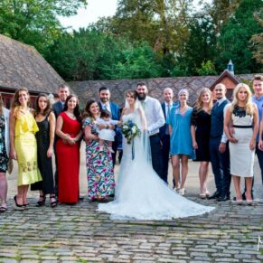 Five Arrows Waddesdon wedding photography group pose in the cobbled courtyard