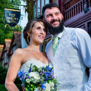 Five Arrows Waddesdon wedding photography of the newlyweds captured at the front of the hotel