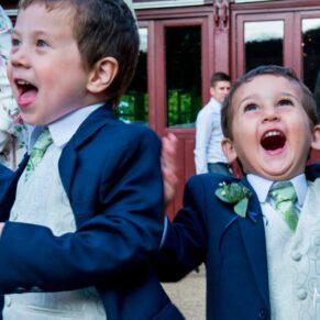 Five Arrows Waddesdon wedding photography of the pageboys chasing bubbles