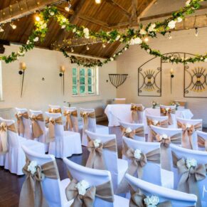 The stunning room setup for a civil ceremony in the stables at The Five Arrows in Waddesdon