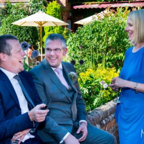 Five Arrows Waddesdon wedding photography - enjoying the drinks reception banter