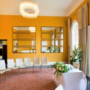 The colourful ceremony room setup at The Grove Hotel in Watford
