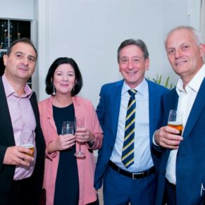 A small group informally pose for the camera during the drinks reception at The Grove Hotel