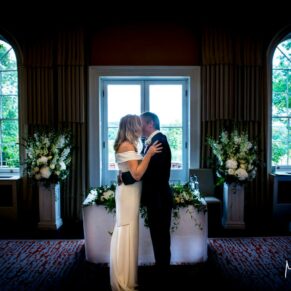 The newlyweds first kiss captured during the indoor civil ceremony