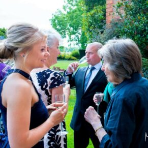 Enjoying the banter during the drinks reception in the hotel's gardens