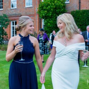 The bride with her daughter taking a stroll through the venue's landscaped gardens