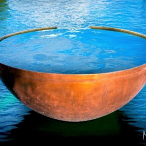 Fabulous copper water bowl sculpture on the water at The Grove Hotel