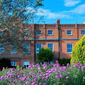 Stunning exterior and garden captured on a sunny summer's day at The Grove in Watford