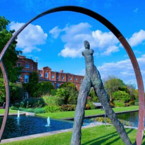 The striking modern sculptures in the gardens of The Grove captured under near perfect blue skies on this wedding day