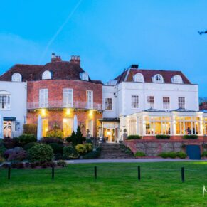 A night shot of the venue under dusky blue skies