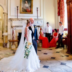Wokefield Estate Berkshire Wedding Photography - the bride in the grand entrance poses for the camera