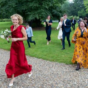 A frantic dash across the lawn by the bride and her guests to escape the rainy British conditions