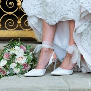 Cliveden House wedding photography of the bride's shoes and bouquet
