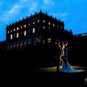 Cliveden House wedding photography - floodlit pose at dusk
