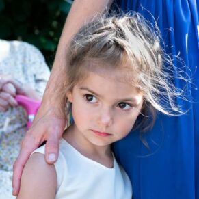 Portrait of a rather nervous young flower girl pre ceremony
