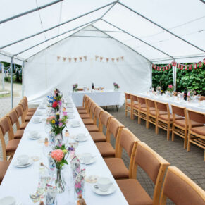 Wide view of the stunning marquee interior at this woodland venue