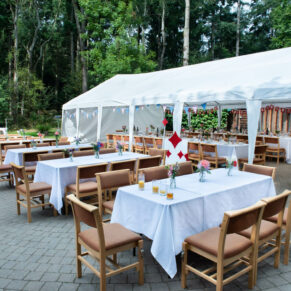The fabulously decorated marquee exterior captured at this lovely woodland venue