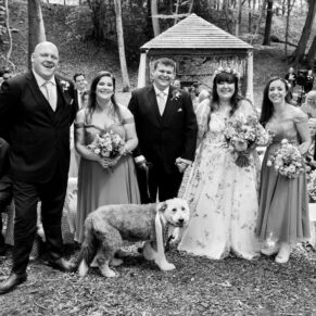 Relaxed group pose captured just after the civil ceremony at this woodland marriage