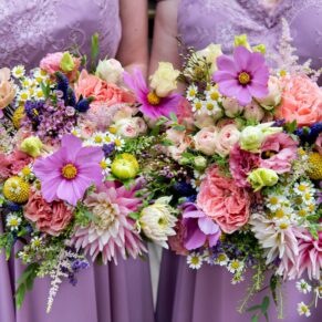 The bridesmaids vibrant bouquets at this Kings Chapel wedding, Old Amersham